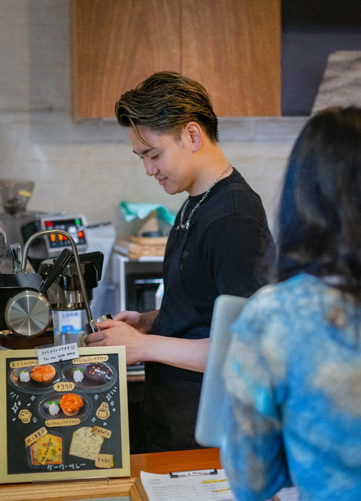 Barista Serving Customer at Tokyo Coffee Shop