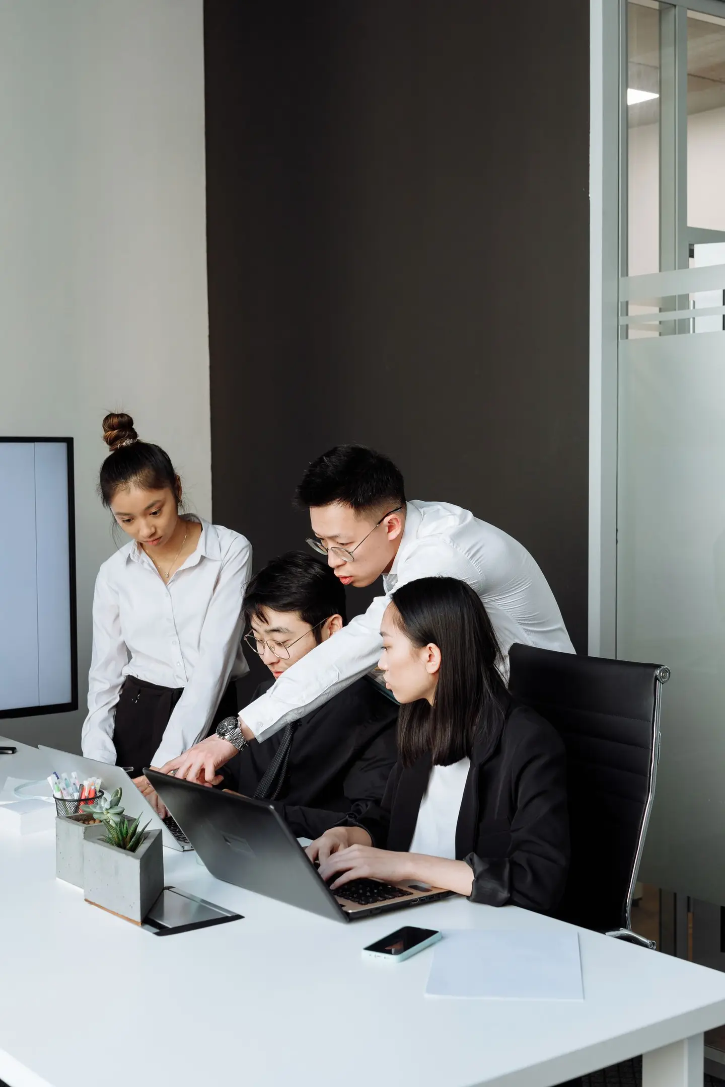 Business People Looking at the Laptop