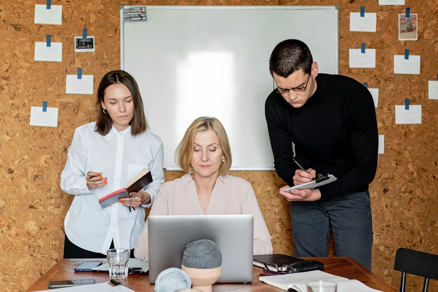 People in the Office Having Meeting While Taking Notes