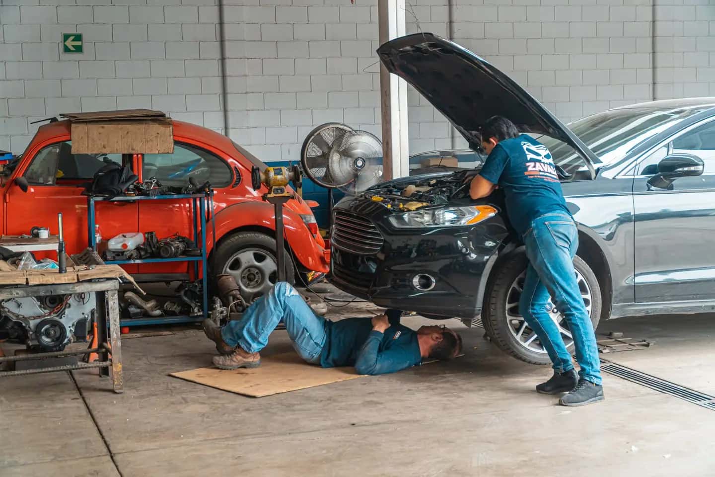 Mechanics Working with Cars
