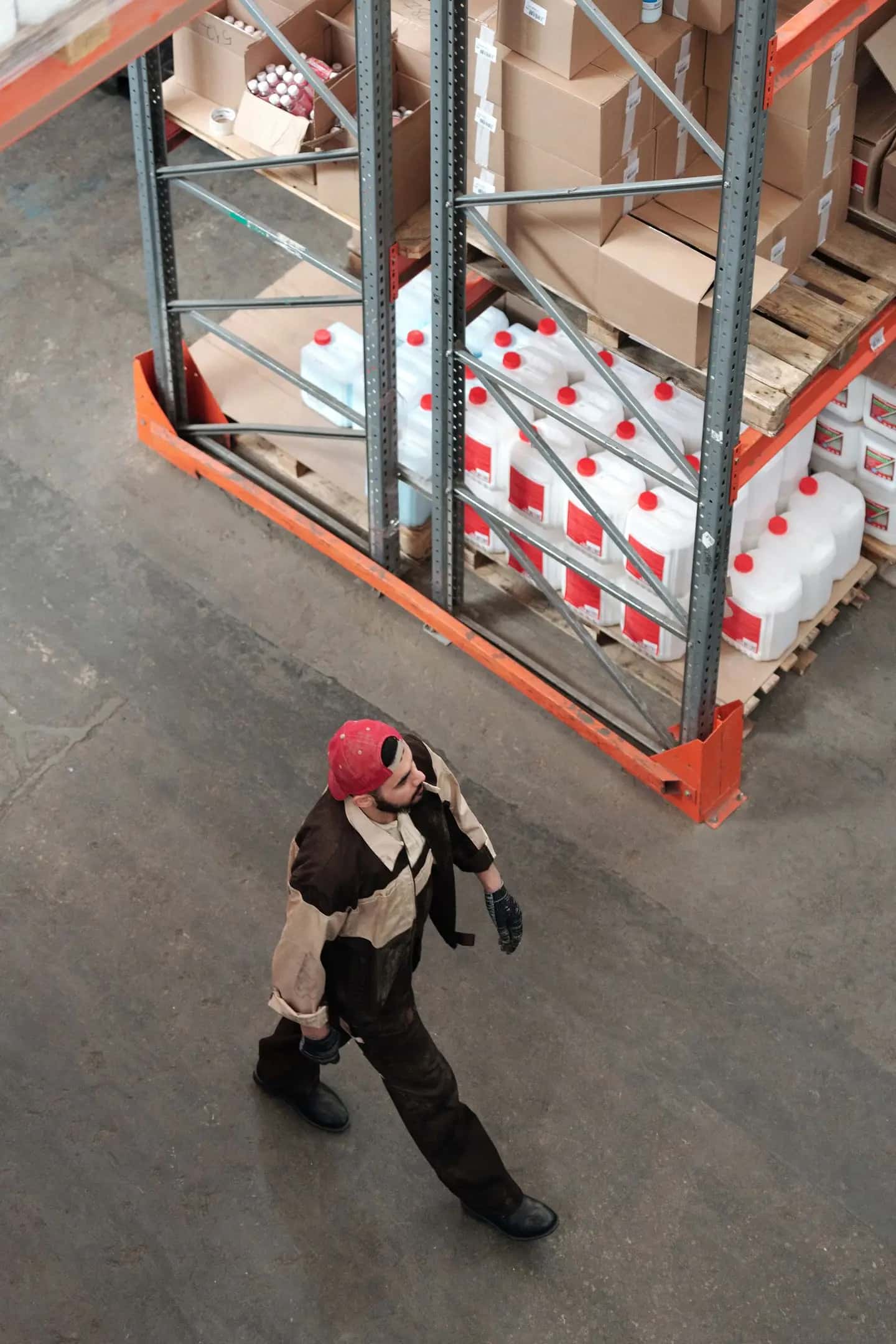 Man Walking in a Warehouse