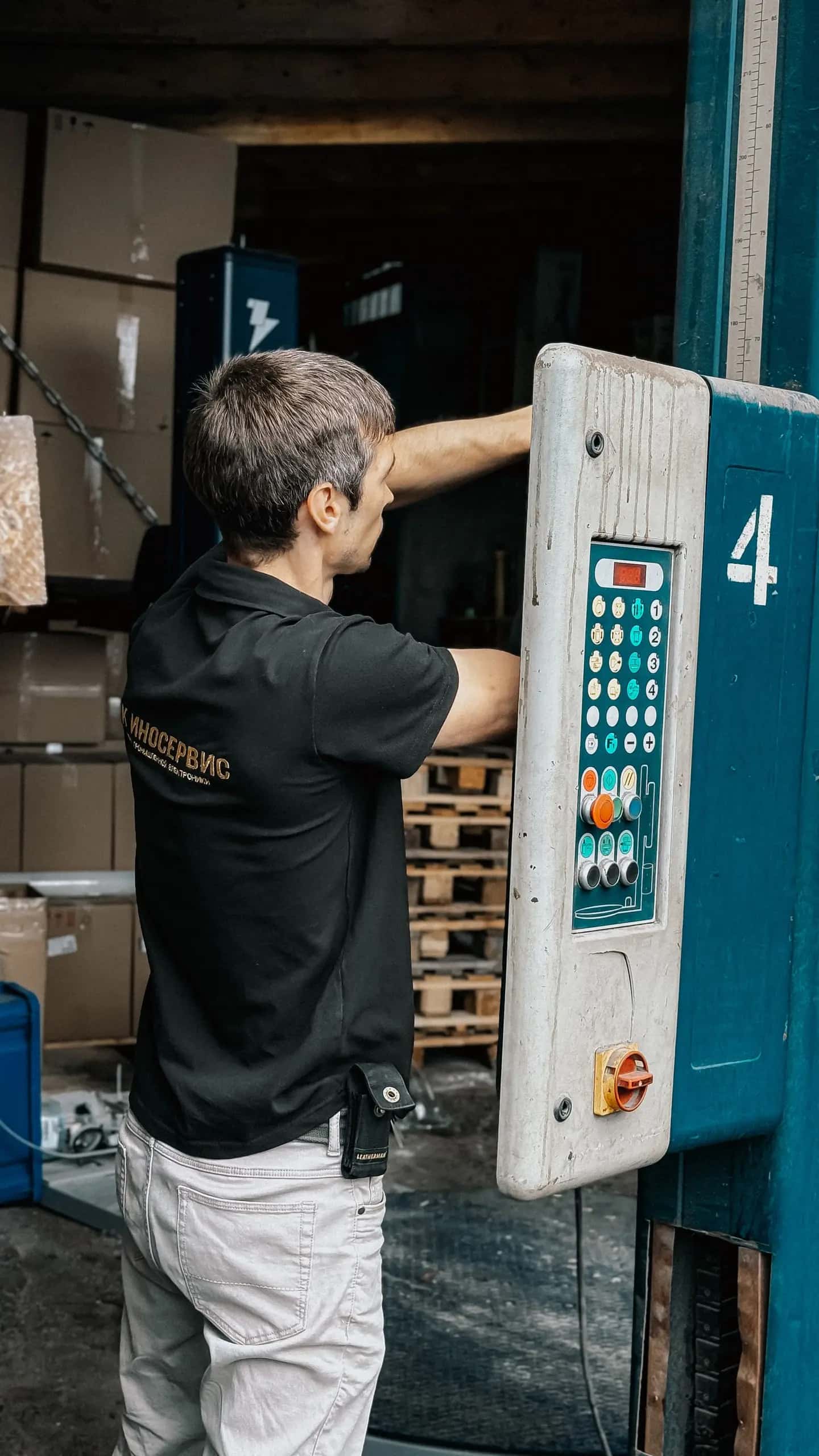 Warehouse Worker Operating Loading Dock Panel