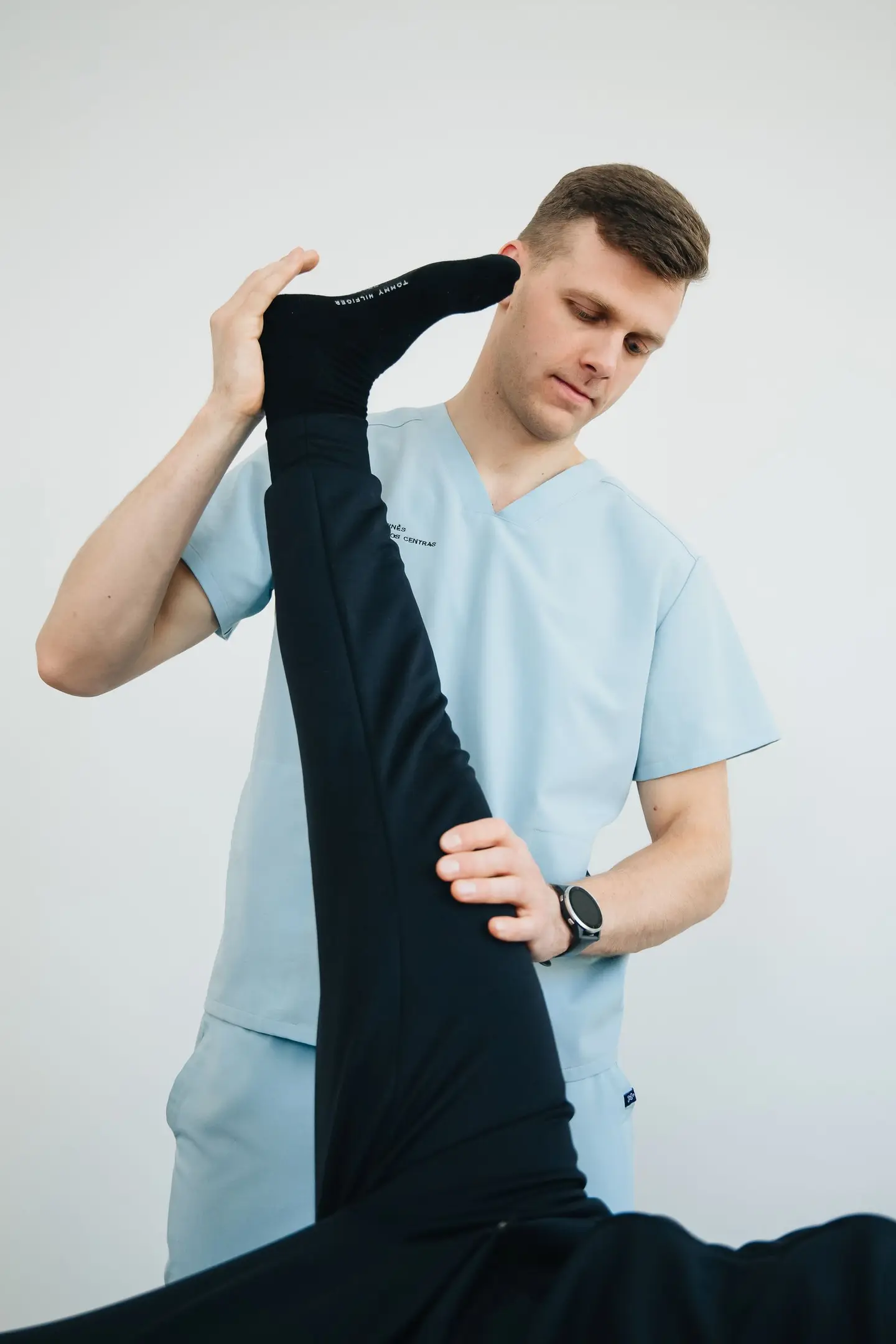 A physiotherapist helping a patient during an appointment