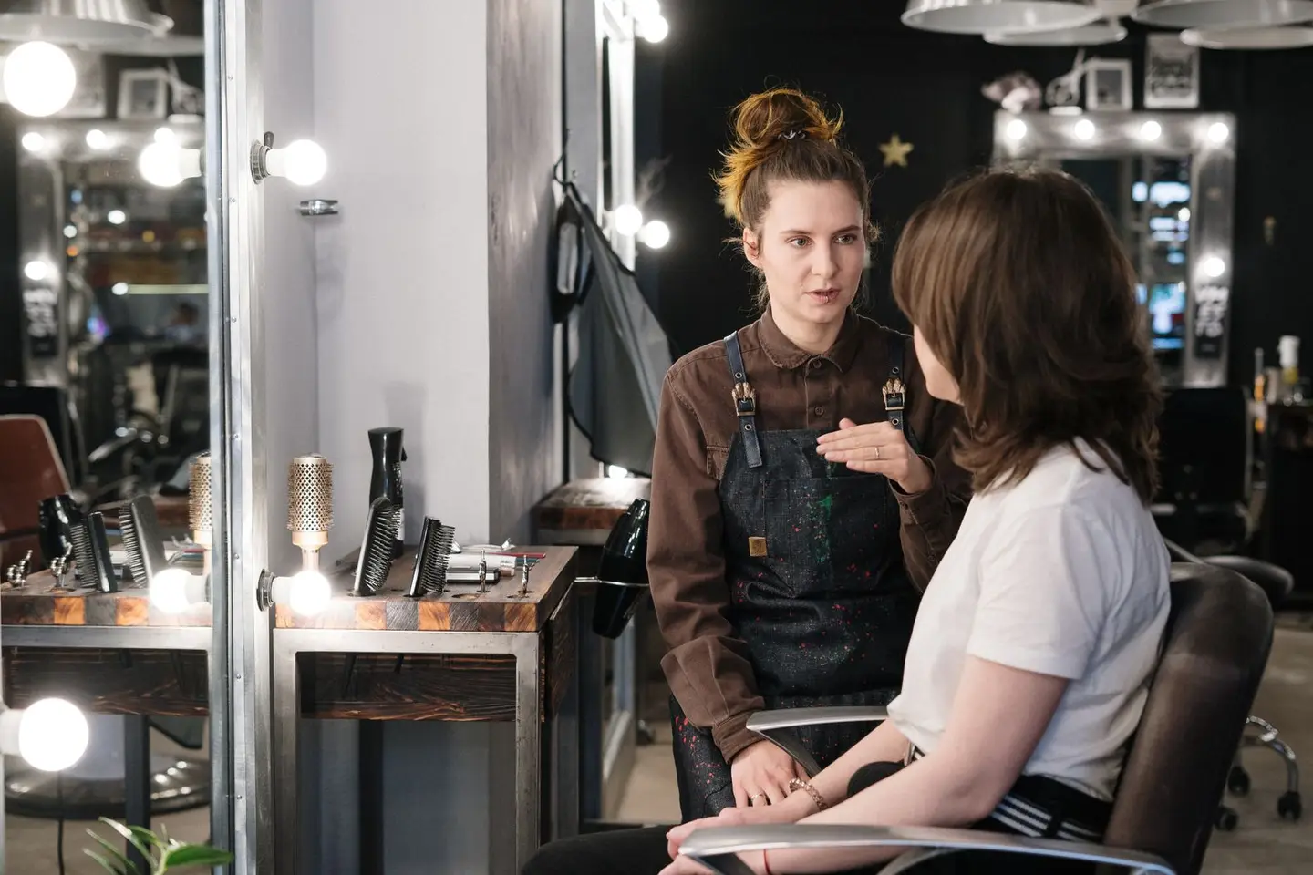 A hairdresser working with a client in a salon