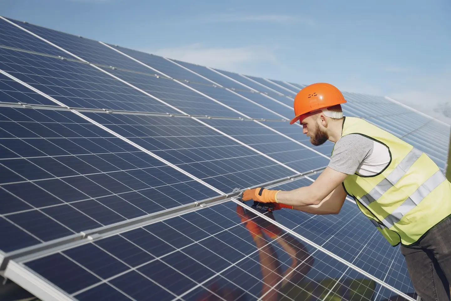 Solar Technician Installing Solar Panel