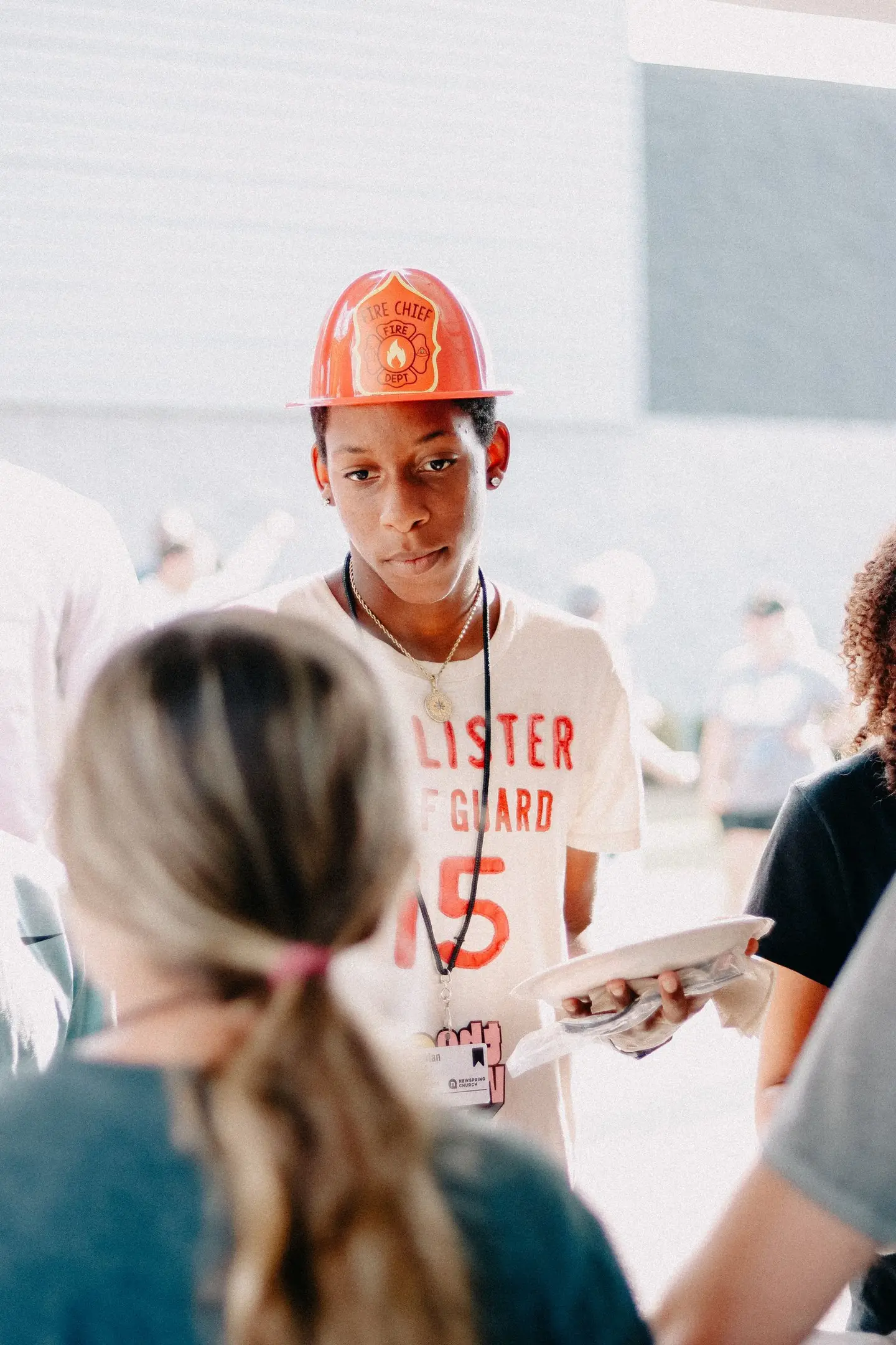 Youth Volunteer Serving at Community Event